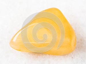 tumbled yellow Aventurine gem stone on white