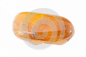 tumbled yellow garnet spessartine gem on white