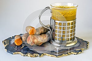 Tumeric Latte with tubers in cup
