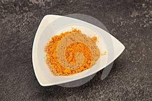 Tumeric powder in the bowl