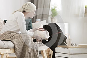 Tumor patient caressing her dog