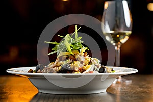 Tun salad with olives, corn and rocket