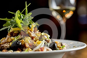 Tun salad with olives, corn and rocket