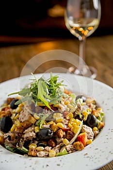 Tun salad with olives, corn and rocket