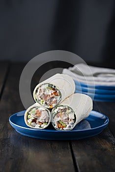 Tuna burritos with avocado tomato and mayonnaise