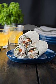 Tuna burritos with avocado tomato and mayonnaise