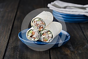 Tuna burritos with avocado tomato and mayonnaise