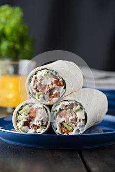 Tuna burritos with avocado tomato and mayonnaise