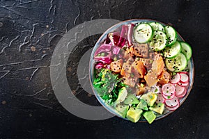 Tuna poke bowl with avocado, cucumbers, wakame, radish, and purple cabbage