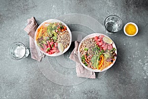 Tuna poke bowl with quinoa and vegetales. budda bowl. Quinua tuna salad on gray background photo