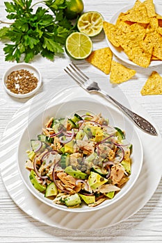 tuna salad with avocado, onion, cucumber, capers