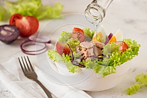 Tuna salad. Nicoise - fresh salad with canned fish and vegetable