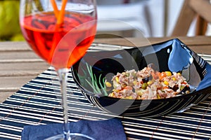 Tuna salads on bread and Aperol Spritz