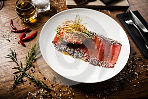 Tuna sashimi served on a plate in restaurant