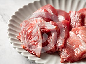 Tuna sashimi in various parts on a plate