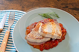 Tuna steak cooked in a sweet and sour sauce