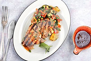 Tuna steak fried with grilled vegetables