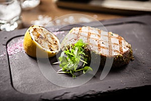 Tuna steak with panko and grilled lemon photo