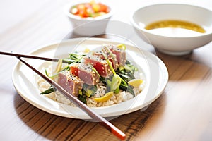 tuna steak seared with sesame seeds and chopsticks
