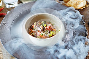 Tuna tartare. Ponzu sauce, chives, cucumber, masago and nori. Delicious healthy Italian traditional food closeup served