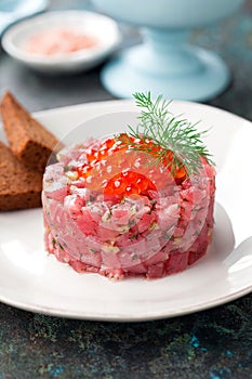 Tuna tartare with salmon caviar, pickled cucumbers, dill and rye bread