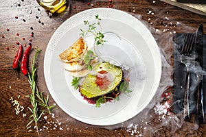 Tuna tartare. Trout roe, avocado cream, marinated onions. Delicious healthy Italian traditional food closeup served for