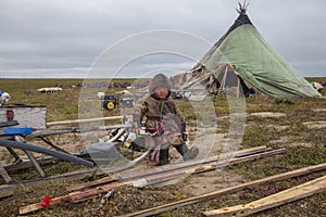 Tundra, The extreme north, Yamal, the pasture of Nenets people, children on vacation playing near reindeer pasture