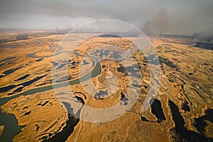 tundra fire. Burning dry grass and peat bogs, fire and smoke in