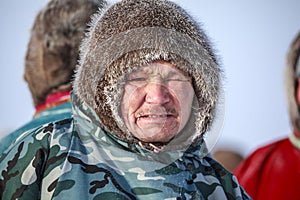 Tundra, open area, assistant reindeer breeder,  the men  in national clothes, Races on reindeer sled in the Reindeer Herder`s Day
