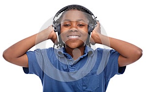 This tune is awesome. An African-American boy listening to music over his headphones.