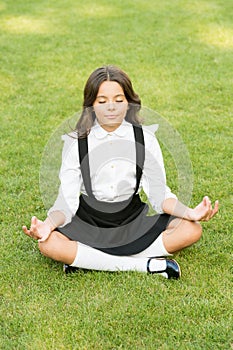Tune in for productive day. Yoga training. Kid adorable schoolgirl meditate. Meditation practice. Good vibes. Peaceful