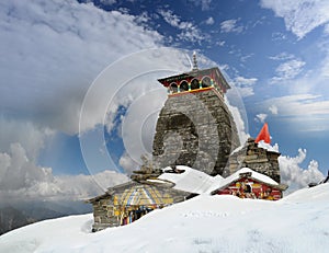 Tungnath Shiva temple on a clouds background
