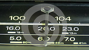 Tuning Analog Radio Dial Frequency on Scale of the Vintage Receiver
