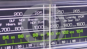 Tuning Analog Radio Dial Frequency on Scale of the Vintage Receiver