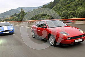 Tuning cars racing down the highway