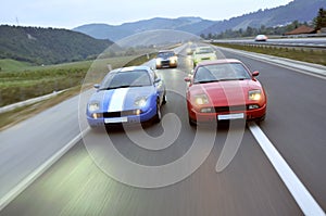 Tuning cars racing down the highway