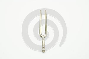 A tuning fork 440 Hz on a white background