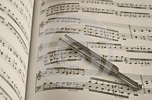 Tuning fork on music photo