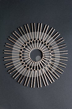 Tuning fork round pattern on a black background, centered circular pattern photo