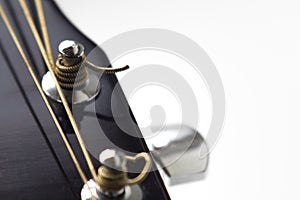 tuning pegs on the fretboard of a guitar