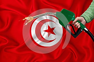 TUNISIA flag Close-up shot on waving background texture with Fuel pump nozzle in hand. The concept of design solutions. 3d