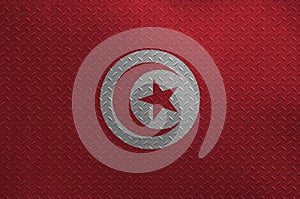 Tunisia flag depicted in paint colors on old brushed metal plate or wall closeup. Textured banner on rough background