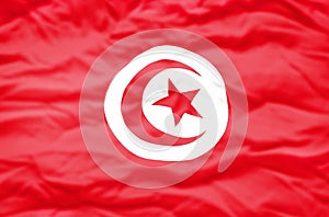 Tunisia flag on a wavy background.