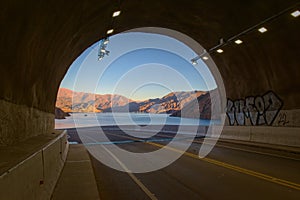 Tunnel exit overlooking Lake Potrerillos at dawn, in Mendoza, Argentina