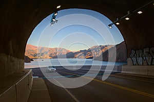 Tunnel exit overlooking Lake Potrerillos at dawn, in Mendoza, Argentina