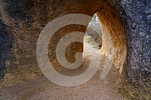 Tunnel formed in the stone rock eroded by time in the Enchanted City