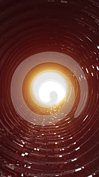 Tunnel of golden glowing rings forming a sci-fi vortex effect