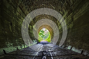 Tunnel with green forest landscape near the village of Slavosovce photo