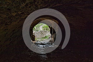 a tunnel in an old castle ruin