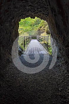 Tunnel passage to  Mikaeri No Taki waterfall in Dakigaeri Valley - Senboku, Akita, Japan